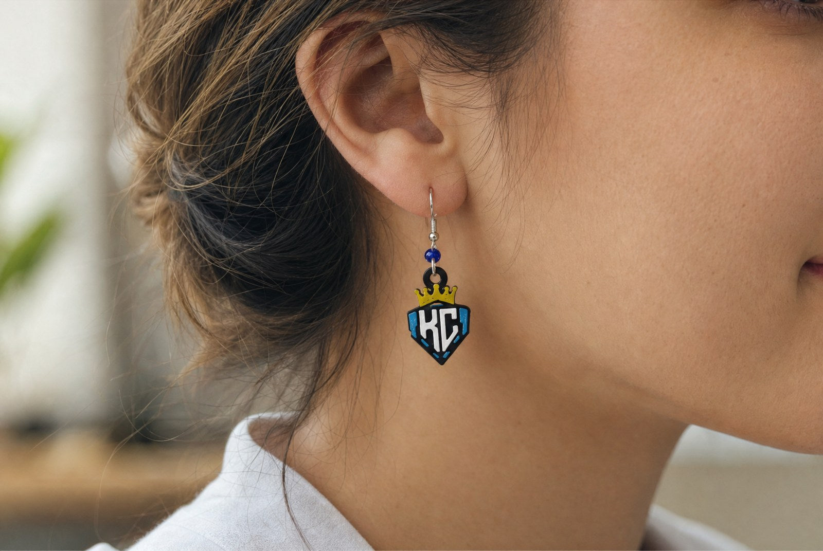 KC Diamonds crown shield earrings in carolina blue, worn