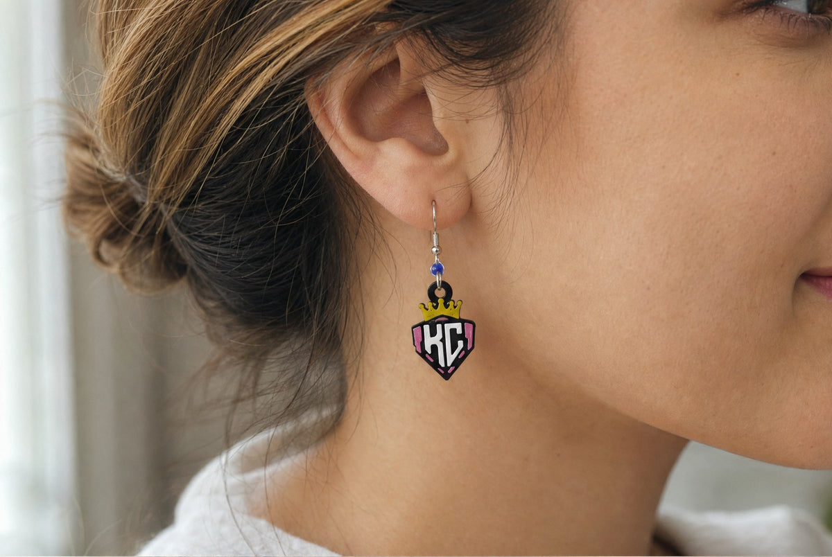 KC Diamonds crown shield earrings in pink, worn